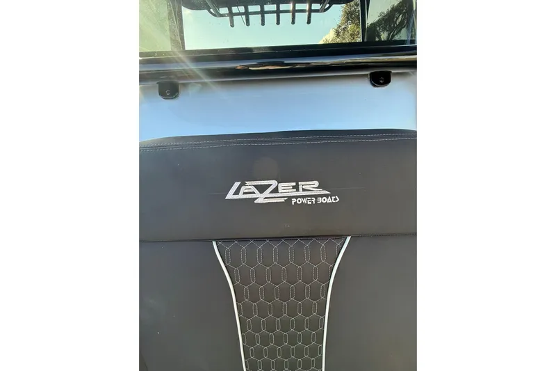  Yacht Photos Pics 2006 Lazer 40 boat seat with logo and hexagonal pattern design.