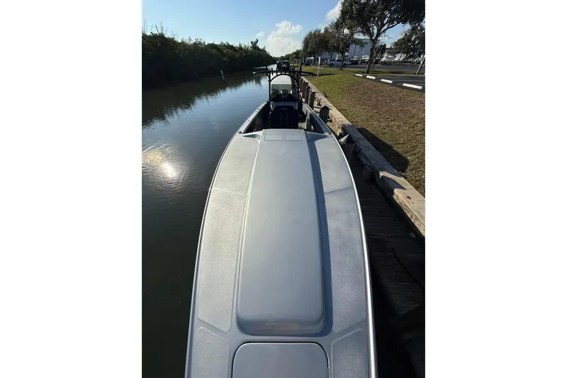  Yacht Photos Pics 2006 Lazer 40 boat docked on a calm canal under a clear sky.