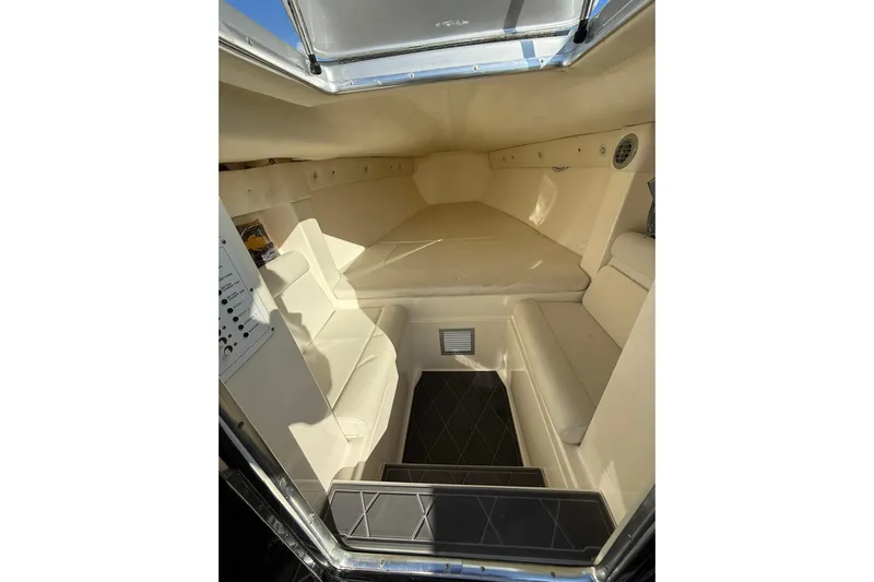  Yacht Photos Pics Interior cabin of a 2006 Lazer 40 boat, featuring beige seating and compact design.