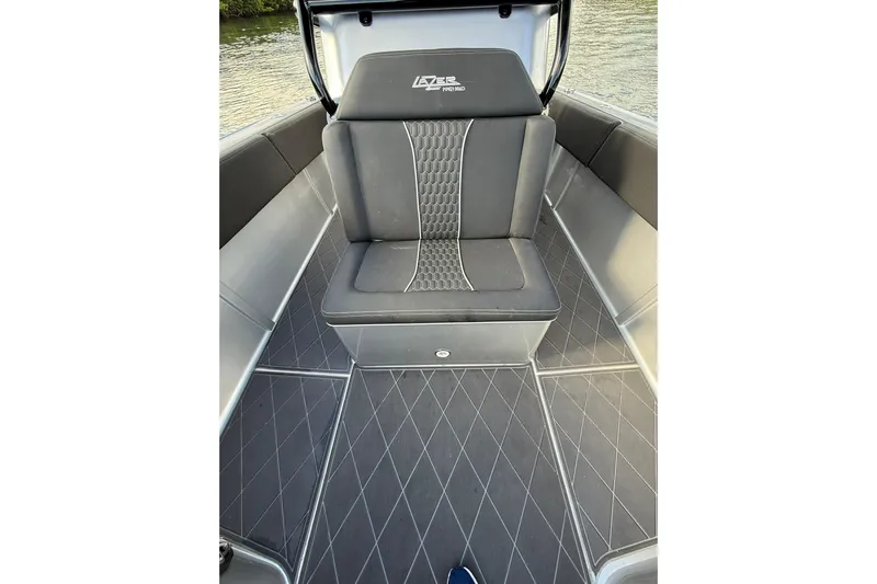  Yacht Photos Pics 2006 Lazer 40 boat interior with gray seating and diamond-patterned flooring.