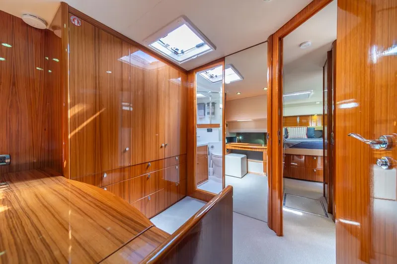 Escape Yacht Photos Pics Luxurious interior of 2013 Maritimo M58 yacht with wood paneling and modern design.