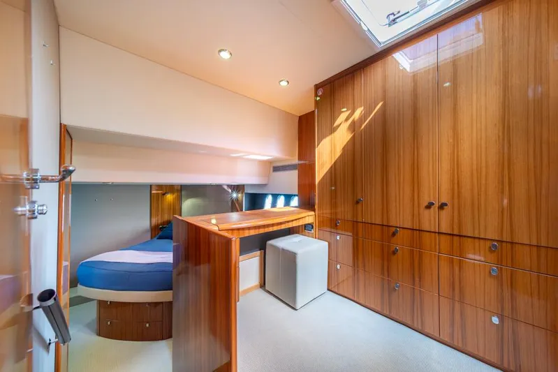 Escape Yacht Photos Pics Luxurious interior of 2013 Maritimo M58 yacht with wood paneling and cozy bed.