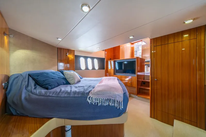 Escape Yacht Photos Pics Luxurious cabin interior of 2013 Maritimo M58 yacht with cozy bed and modern amenities.