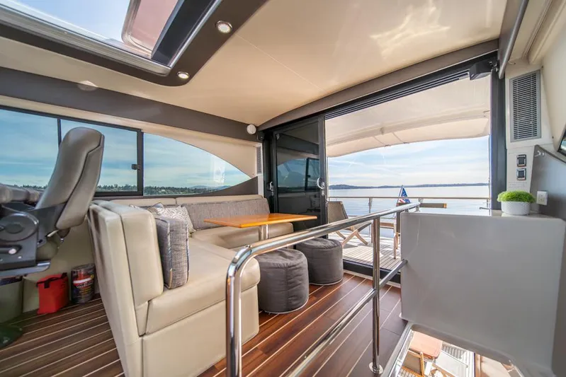 Escape Yacht Photos Pics Luxurious interior of 2013 Maritimo M58 yacht with plush seating and ocean view.