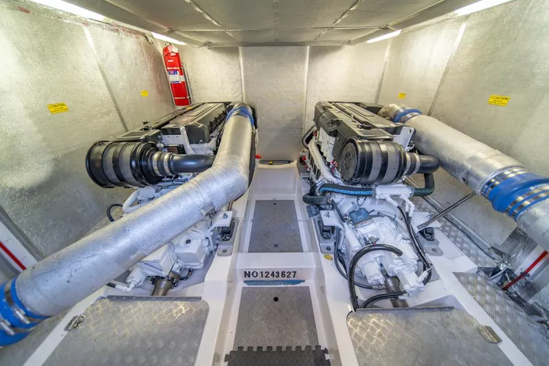 Escape Yacht Photos Pics Engine room of 2013 Maritimo M58 yacht with dual engines and fire extinguisher.