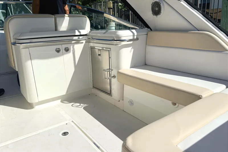 Sweet Melissa Yacht Photos Pics Interior of 2013 Sea Ray 370 Venture boat with seating and storage.