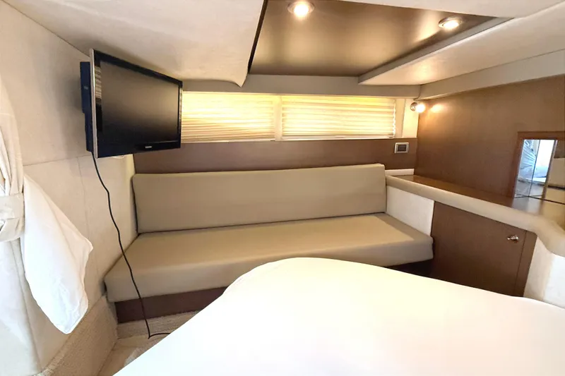 Sweet Melissa Yacht Photos Pics Interior of 2013 Sea Ray 370 Venture yacht with sofa, TV, and modern lighting.