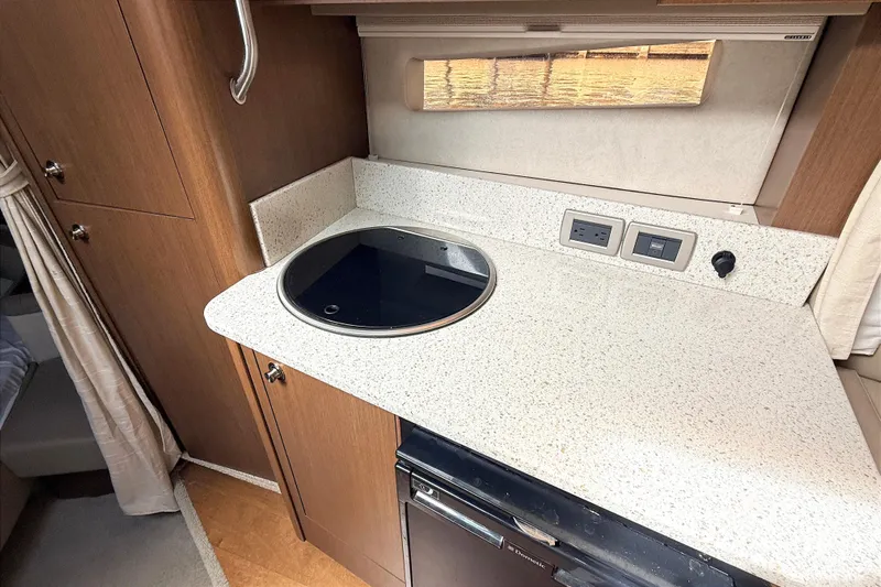 Sweet Melissa Yacht Photos Pics 2013 Sea Ray 370 Venture kitchen area with stovetop and countertop.