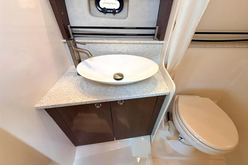 Sweet Melissa Yacht Photos Pics 2013 Sea Ray 370 Venture bathroom with modern sink and toilet.