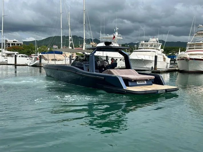 Quoq Yacht Photos Pics Luxury Maori 50 yacht docked in marina, 2016 model, surrounded by other boats.