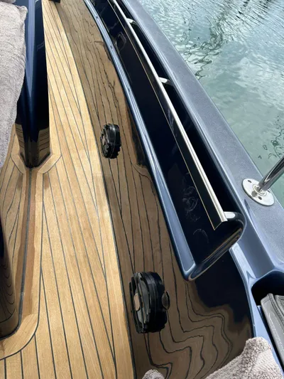 Quoq Yacht Photos Pics Deck of 2016 Maori 50 boat with wooden flooring and sleek design.