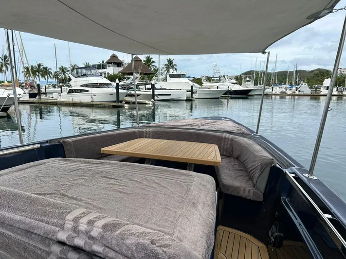 Quoq Yacht Photos Pics Luxurious 2016 Maori 50 yacht interior with wooden table, docked in a marina.