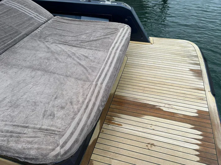 Quoq Yacht Photos Pics Sunbed and teak deck on 2016 Maori 50 yacht by the water.