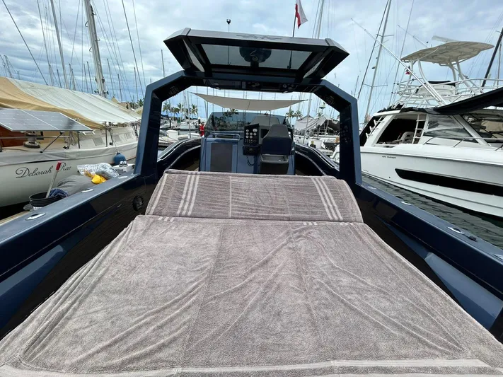 Quoq Yacht Photos Pics Luxurious 2016 Maori 50 yacht docked at marina, featuring spacious deck and modern design.