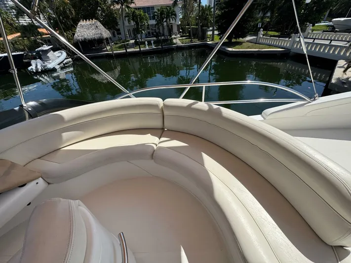 Weekender 3 Yacht Photos Pics Luxurious seating on 2005 Azimut 42 Fly yacht, docked by serene waterfront.