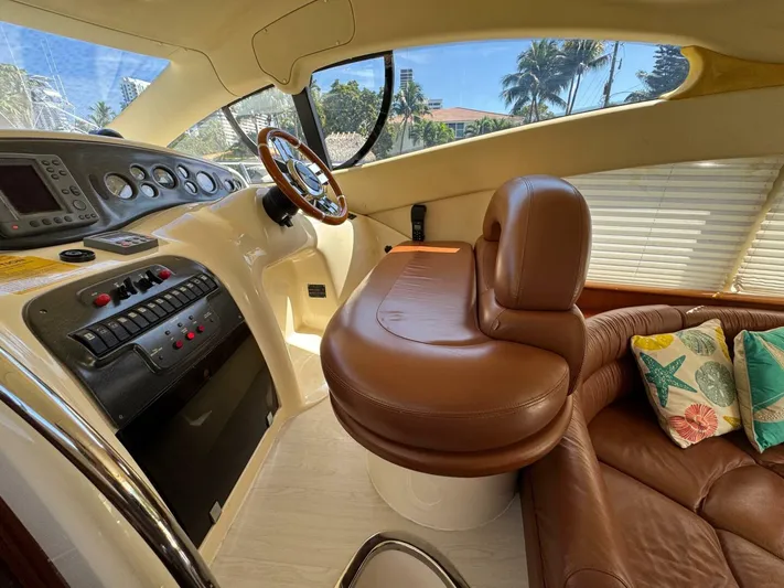 Weekender 3 Yacht Photos Pics 2005 Azimut 42 Fly yacht interior with leather seating and control panel.