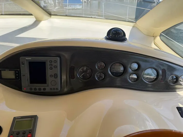 Weekender 3 Yacht Photos Pics Control panel of a 2005 Azimut 42 Fly yacht with navigation instruments.