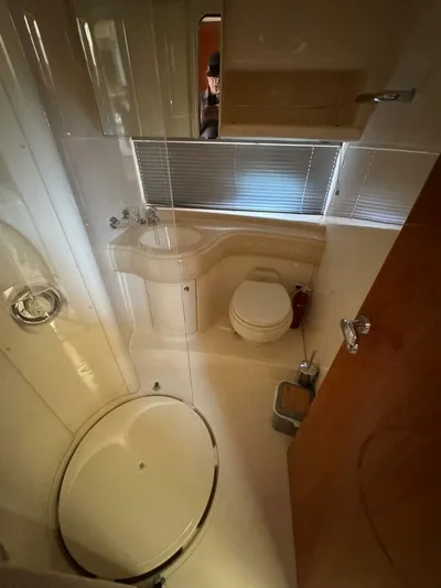 Weekender 3 Yacht Photos Pics Bathroom interior of 2005 Azimut 42 Fly yacht, featuring shower and toilet.