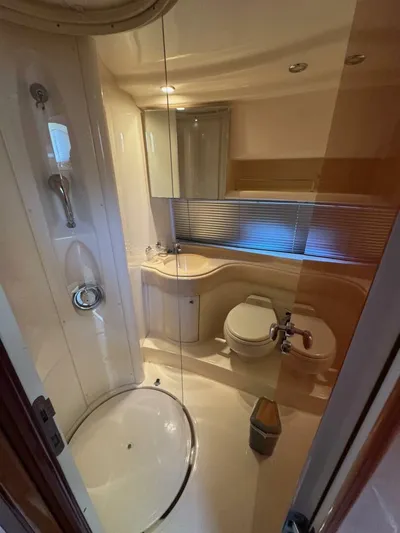 Weekender 3 Yacht Photos Pics Luxurious bathroom in 2005 Azimut 42 Fly yacht with modern fixtures and elegant design.