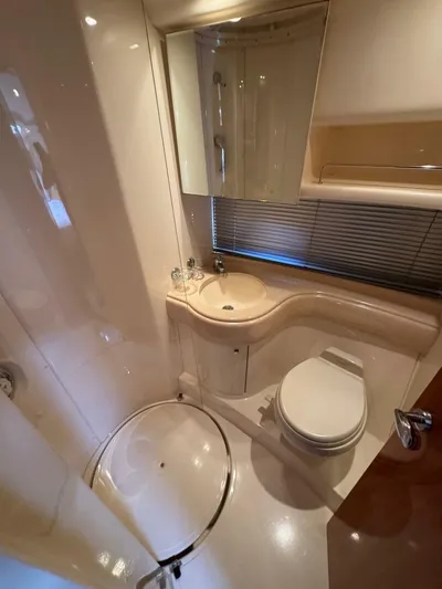 Weekender 3 Yacht Photos Pics 2005 Azimut 42 Fly yacht bathroom with modern fixtures and compact design.