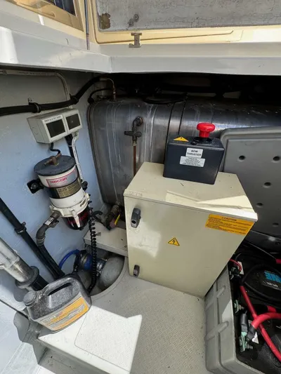 Weekender 3 Yacht Photos Pics Engine room of 2005 Azimut 42 Fly yacht, featuring equipment and storage.