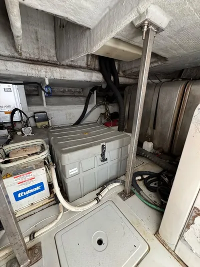 Weekender 3 Yacht Photos Pics Engine room of 2005 Azimut 42 Fly yacht, showing equipment and storage.