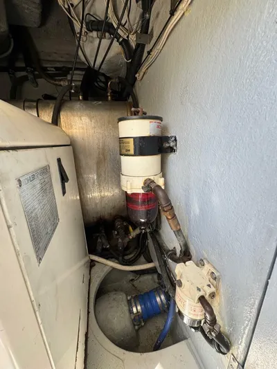 Weekender 3 Yacht Photos Pics Engine room of 2005 Azimut 42 Fly yacht, showing fuel filter and piping.