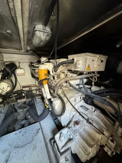 Weekender 3 Yacht Photos Pics Engine room of 2005 Azimut 42 Fly yacht, showcasing mechanical components and wiring.