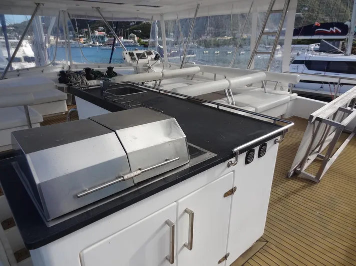 Dalliance Yacht Photos Pics Outdoor kitchen and seating area on a 2014 Leopard 58 yacht.