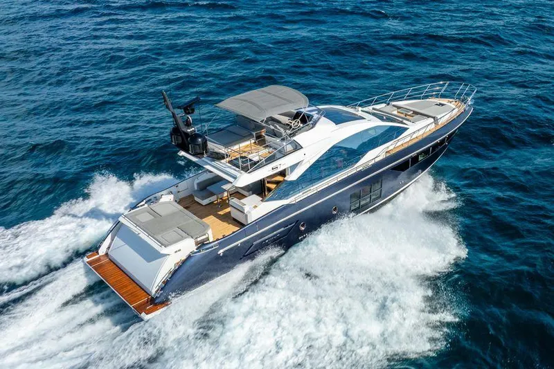  Yacht Photos Pics 2019 Azimut S7 yacht cruising on open sea, showcasing sleek design and luxury features.