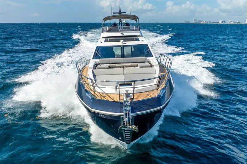  Yacht Photos Pics Luxurious 2019 Azimut S7 yacht cruising on open sea under clear skies.