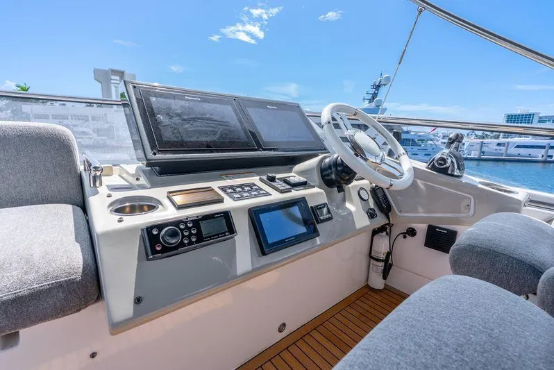  Yacht Photos Pics 2019 Azimut S7 yacht helm with modern navigation equipment and luxurious seating.