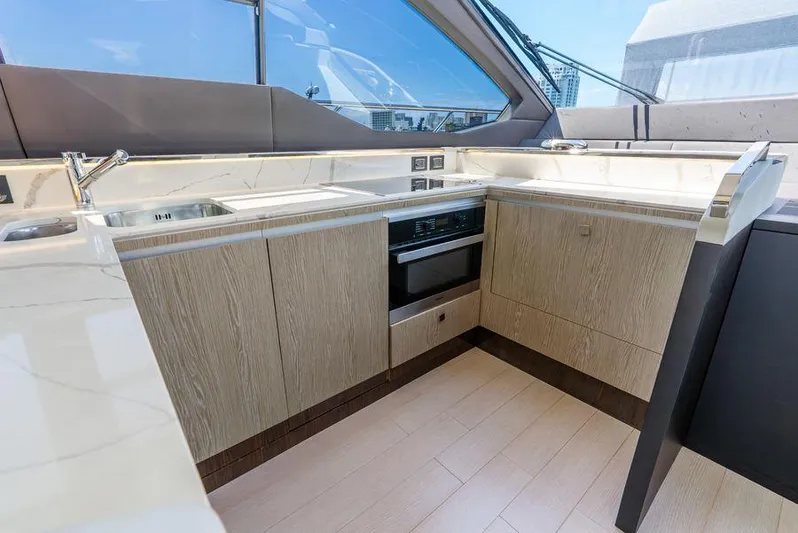  Yacht Photos Pics Luxurious kitchen interior of 2019 Azimut S7 yacht with modern appliances and sleek design.