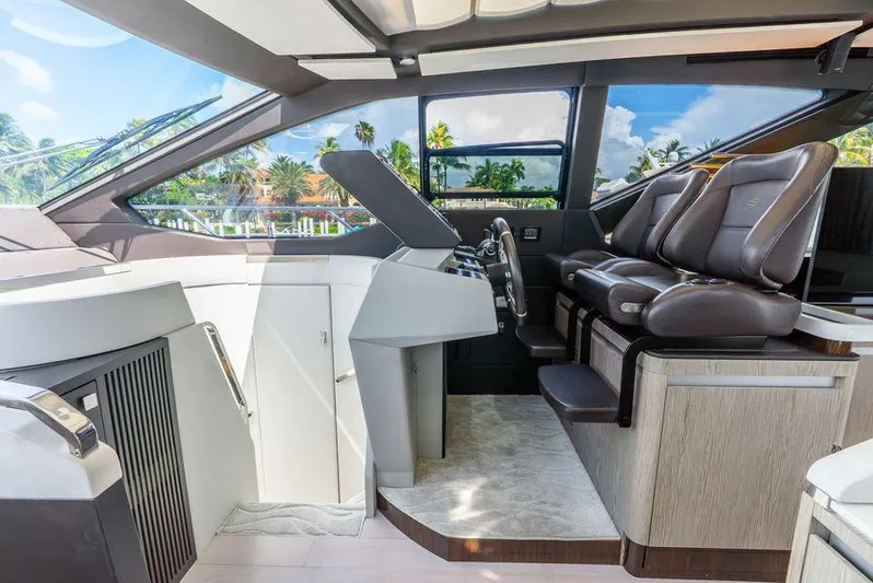  Yacht Photos Pics Luxurious interior of 2019 Azimut S7 yacht with modern helm and leather seating.