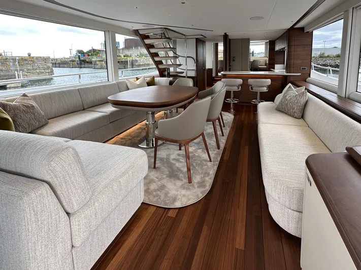 X80034 Yacht Photos Pics Luxurious interior of 2024 Princess X80 yacht with elegant seating and dining area.