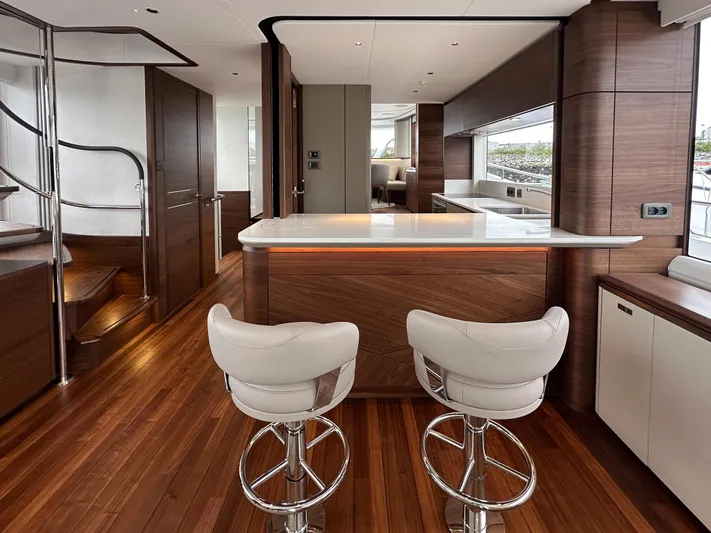 X80034 Yacht Photos Pics Luxurious 2024 Princess X80 yacht interior with modern kitchen and stylish bar stools.