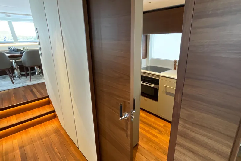 X80034 Yacht Photos Pics Luxurious interior of 2024 Princess X80 yacht with modern kitchen and dining area.