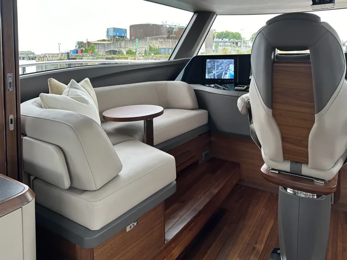 X80034 Yacht Photos Pics Luxurious interior of 2024 Princess X80 yacht with plush seating and modern navigation system.