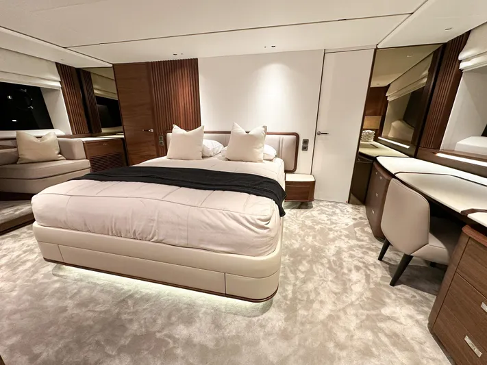 X80034 Yacht Photos Pics Luxurious bedroom interior of 2024 Princess X80 yacht, featuring elegant design and plush furnishings.