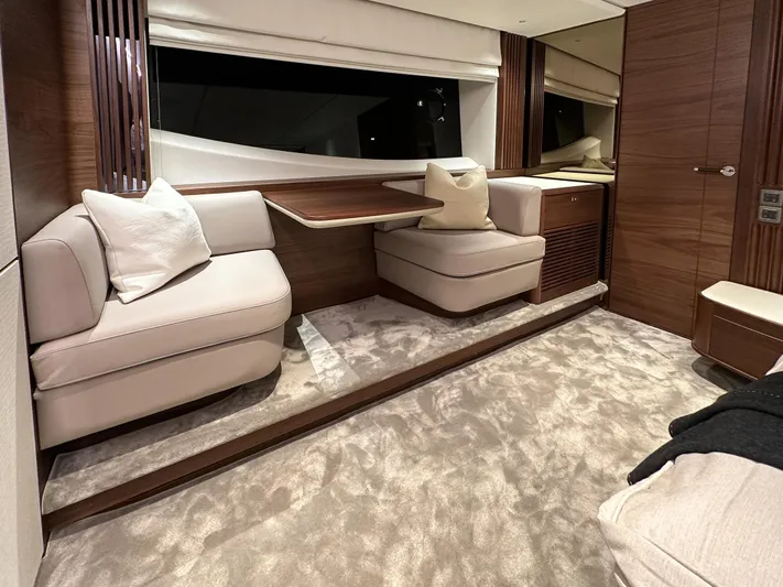 X80034 Yacht Photos Pics Luxurious interior of 2024 Princess X80 yacht with plush seating and elegant wood finishes.