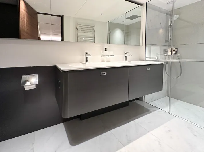 X80034 Yacht Photos Pics Modern bathroom with sleek vanity, glass shower, and elegant fixtures in a 2024 Princess X80 yacht.