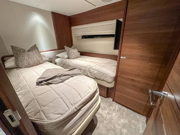 X80034 Yacht Photos Pics Luxurious twin cabin in 2024 Princess X80 yacht with modern wood finishes.