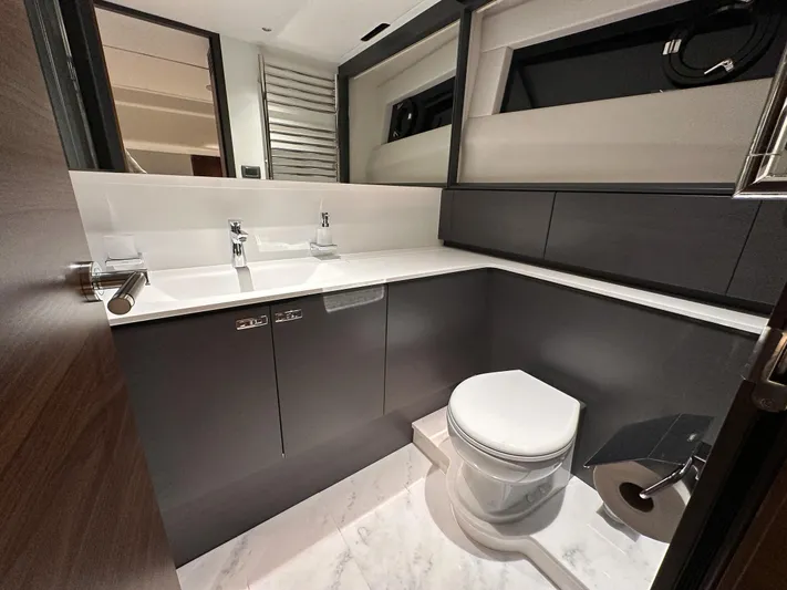 X80034 Yacht Photos Pics Luxurious bathroom in 2024 Princess X80 yacht with modern fixtures and elegant design.