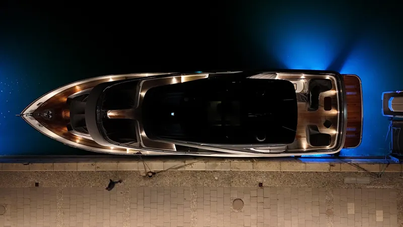 X80034 Yacht Photos Pics Overhead view of illuminated 2024 Princess X80 yacht docked at night.