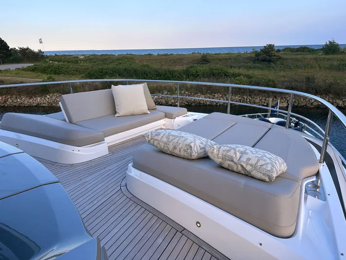 X80034 Yacht Photos Pics Luxurious 2024 Princess X80 yacht deck with elegant seating and scenic ocean view.