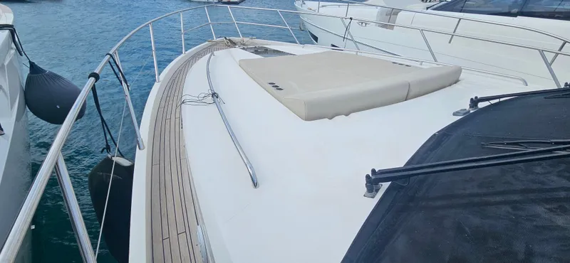  Yacht Photos Pics Luxury Princess 64 yacht deck, 2014 model, docked on calm water.