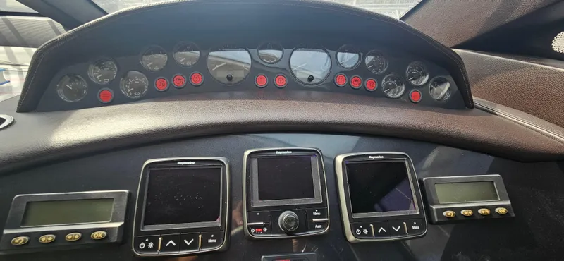  Yacht Photos Pics Control panel of a 2014 Princess 64 yacht with multiple gauges and displays.