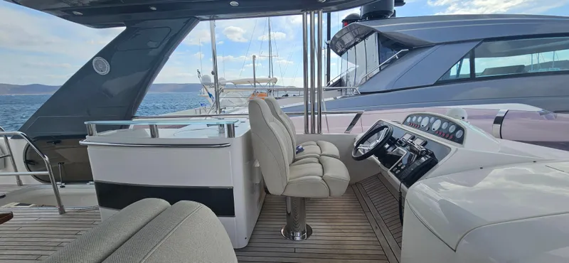  Yacht Photos Pics Luxurious 2014 Princess 64 yacht interior with helm, seating, and ocean view.