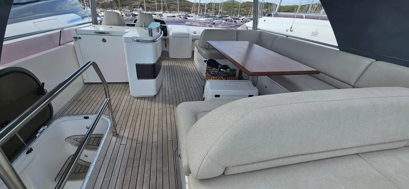  Yacht Photos Pics Luxurious 2014 Princess 64 yacht interior with spacious seating and elegant wooden flooring.