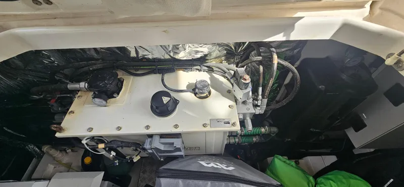  Yacht Photos Pics Engine compartment of a 2014 Princess 64 yacht, showcasing mechanical components and wiring.